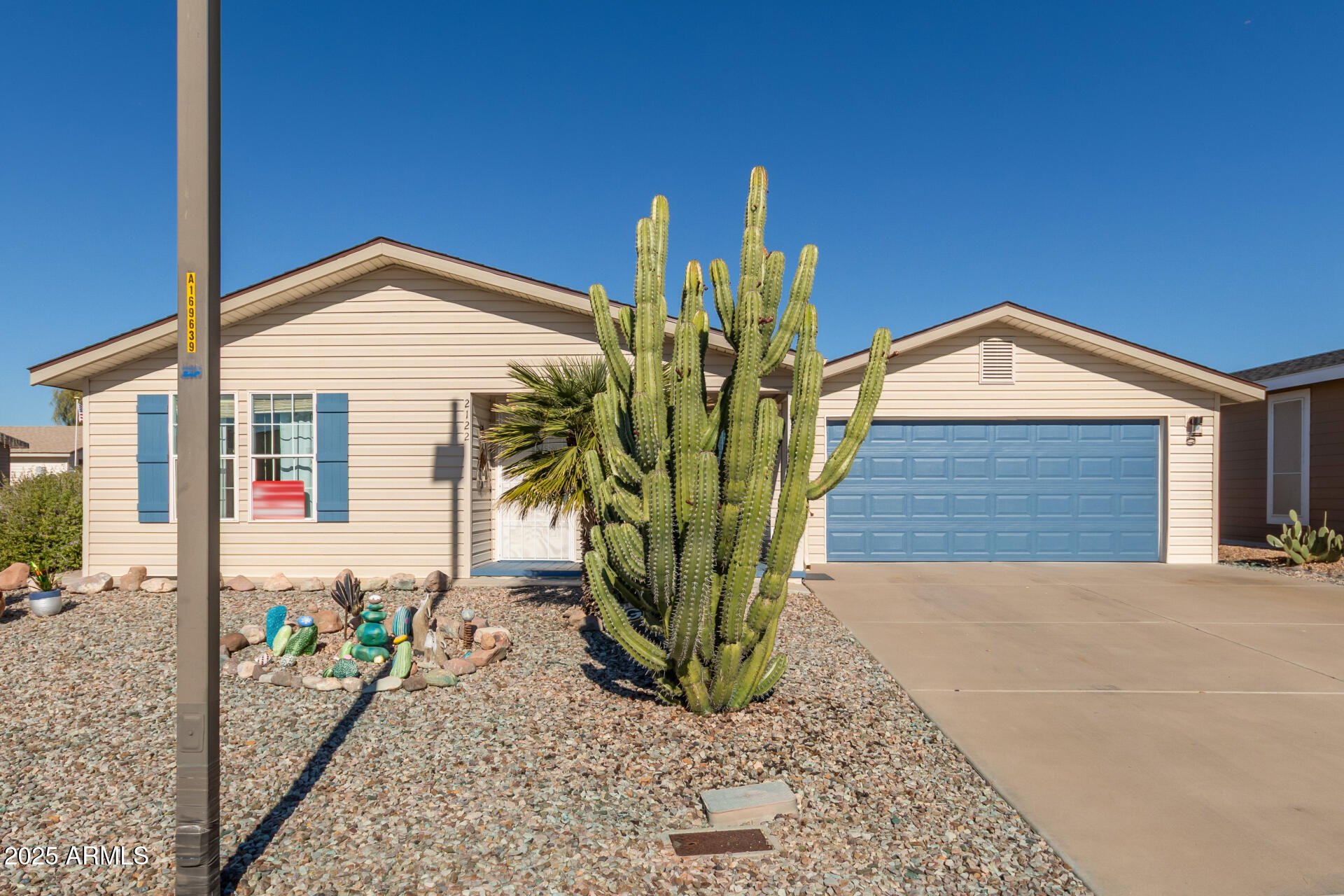 3301 South Goldfield Road, Unit 2122 Apache Junction, AZ 85119 - Photo 35 of 35 a front view of a house with garden