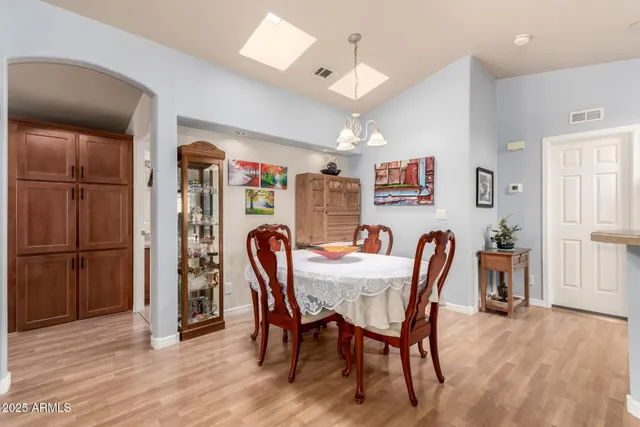 a view of a dining room with furniture and a window