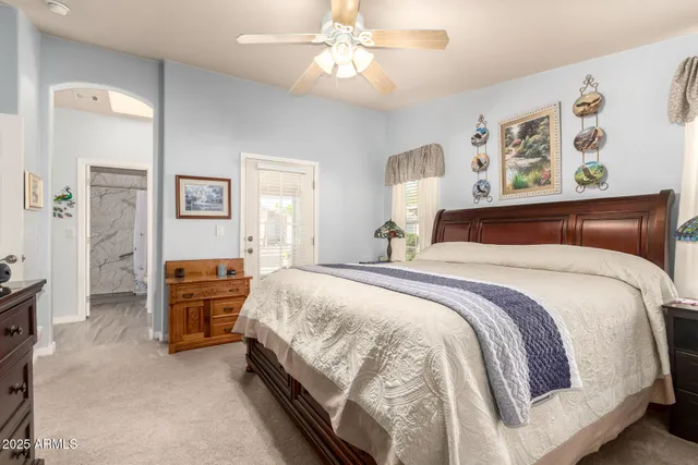 a bedroom with bed and window