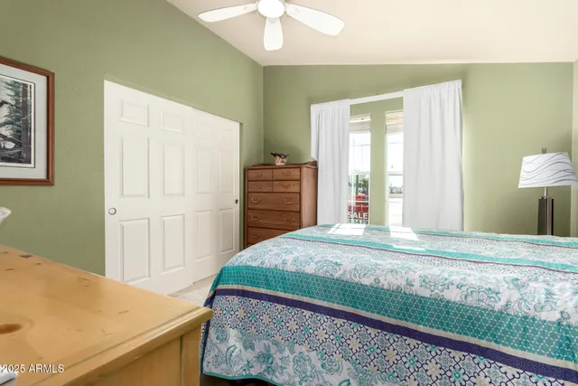 a bedroom with a bed and a dresser