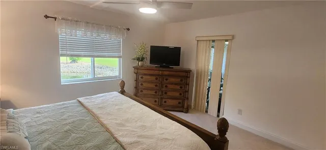 a spacious bathroom with a granite countertop sink mirror and a bathtub