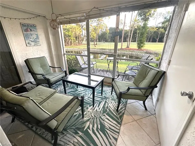 a balcony with chairs and outdoor view