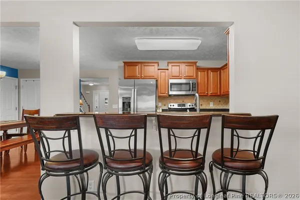 a view of a dining room with furniture and window
