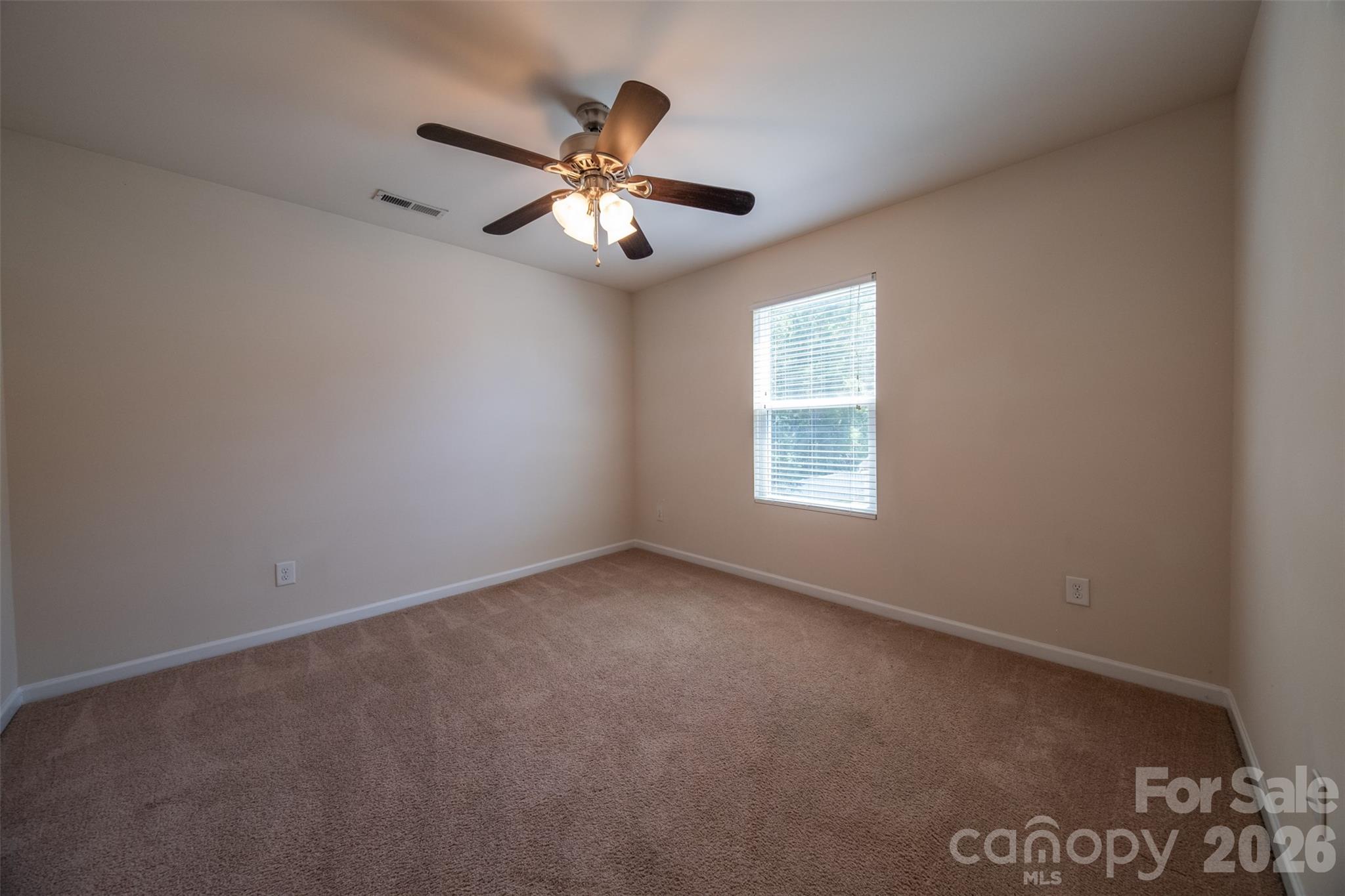 3006 Houndscroft Road Indian Trail, NC 28079 - Photo 23 of 39 an empty room with windows and fan
