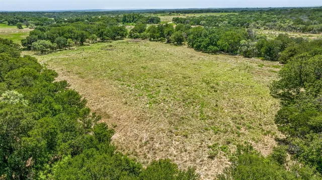a view of a field with an outdoor space