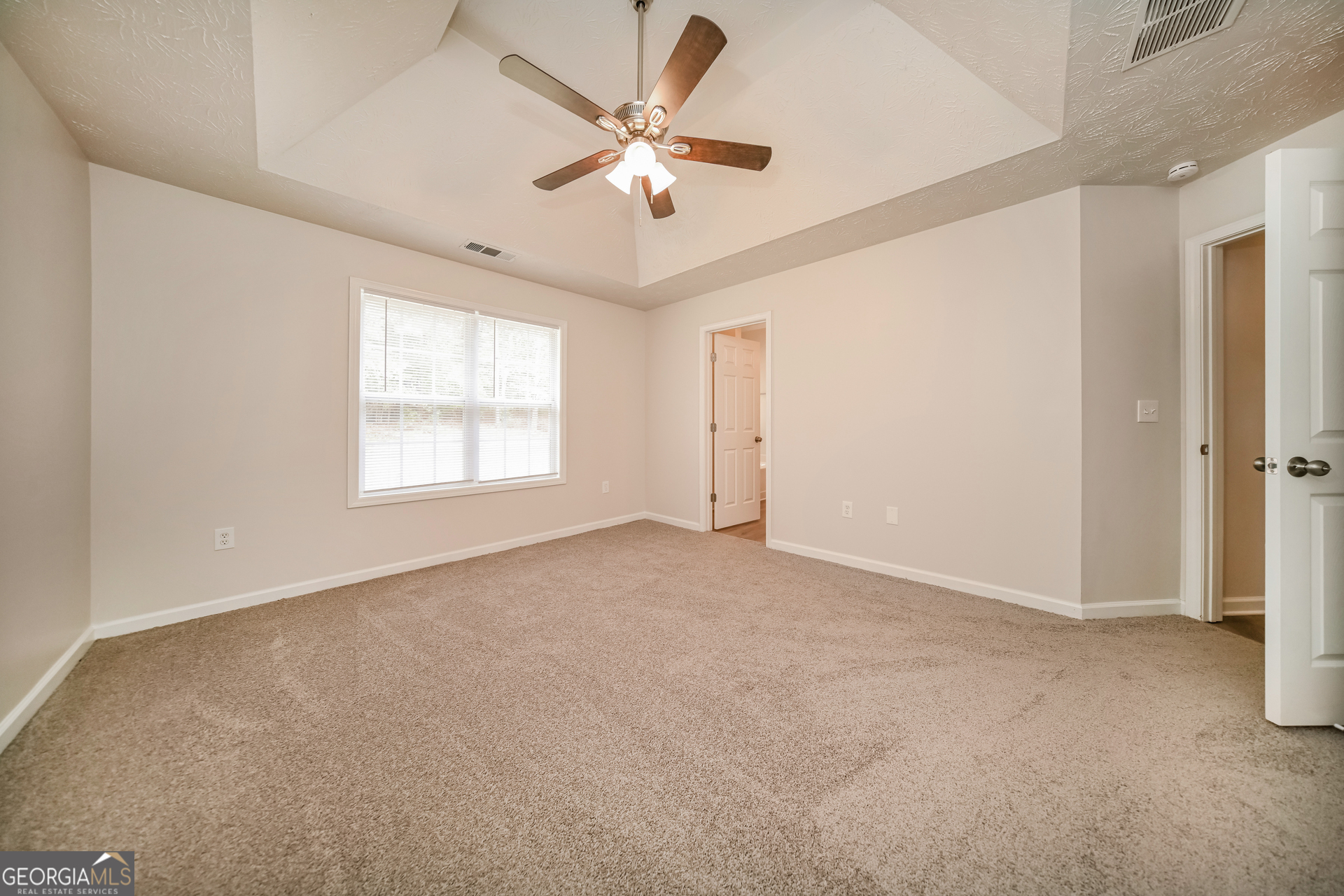 60 Freeman Way Covington, GA 30016 - Photo 9 of 17 a view of an empty room with a window