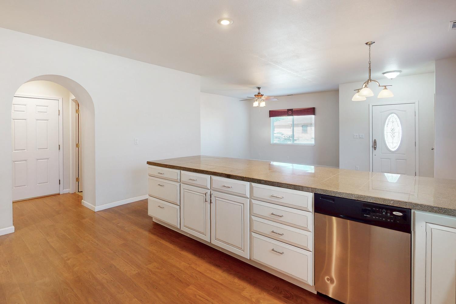 1835 Magnolia Street Gridley, CA 95948 - Photo 11 of 53 a spacious bathroom with a granite countertop sink mirror and vanity