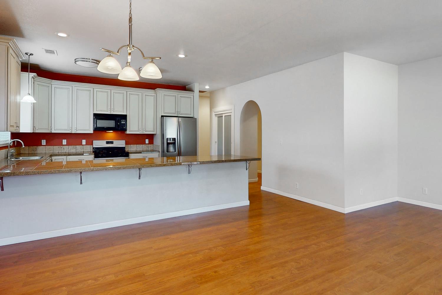 1835 Magnolia Street Gridley, CA 95948 - Photo 13 of 53 a view of kitchen with stainless steel appliances granite countertop a sink window and a microwave