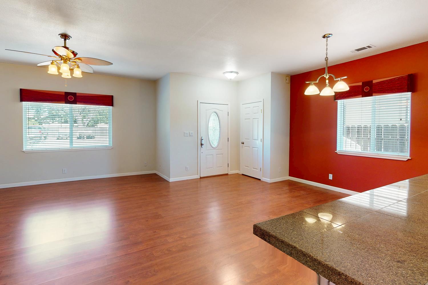 1835 Magnolia Street Gridley, CA 95948 - Photo 16 of 53 a view of an empty room with window and wooden floor
