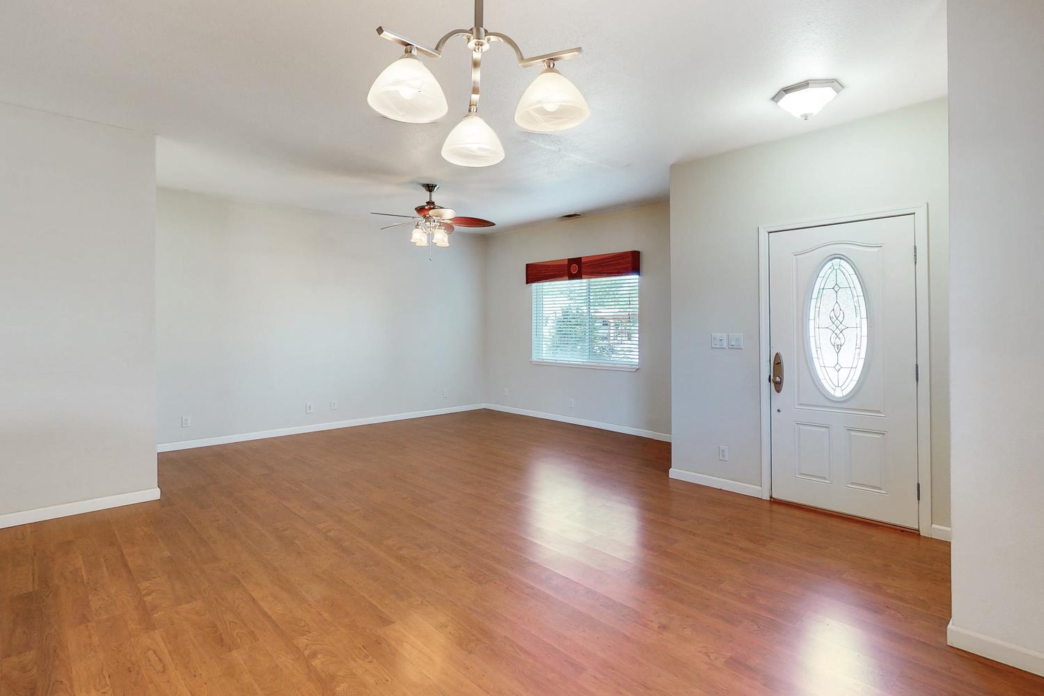 1835 Magnolia Street Gridley, CA 95948 - Photo 18 of 53 wooden floor in an empty room with a window