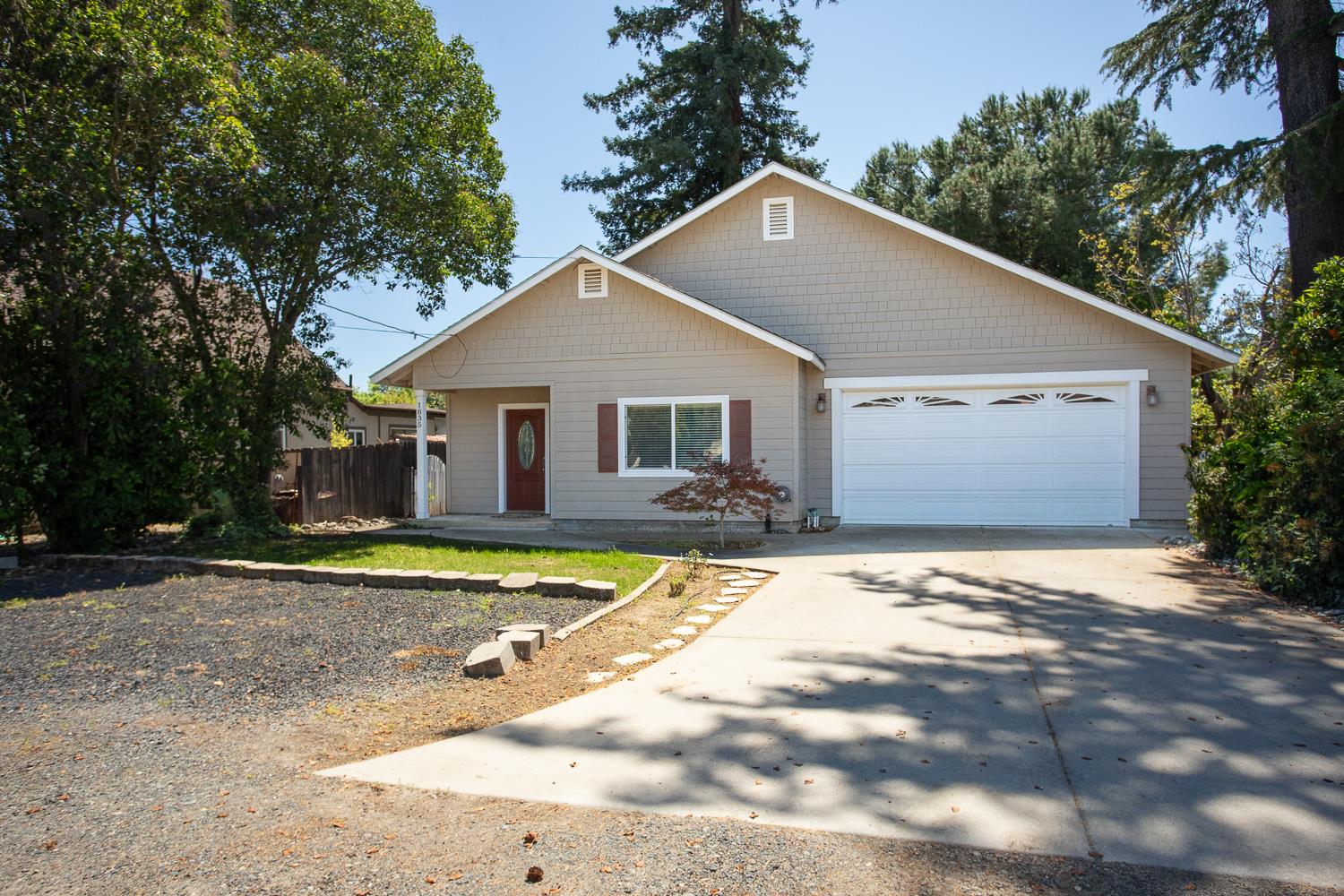 1835 Magnolia Street Gridley, CA 95948 - Photo 2 of 53 a view of a white house with a yard