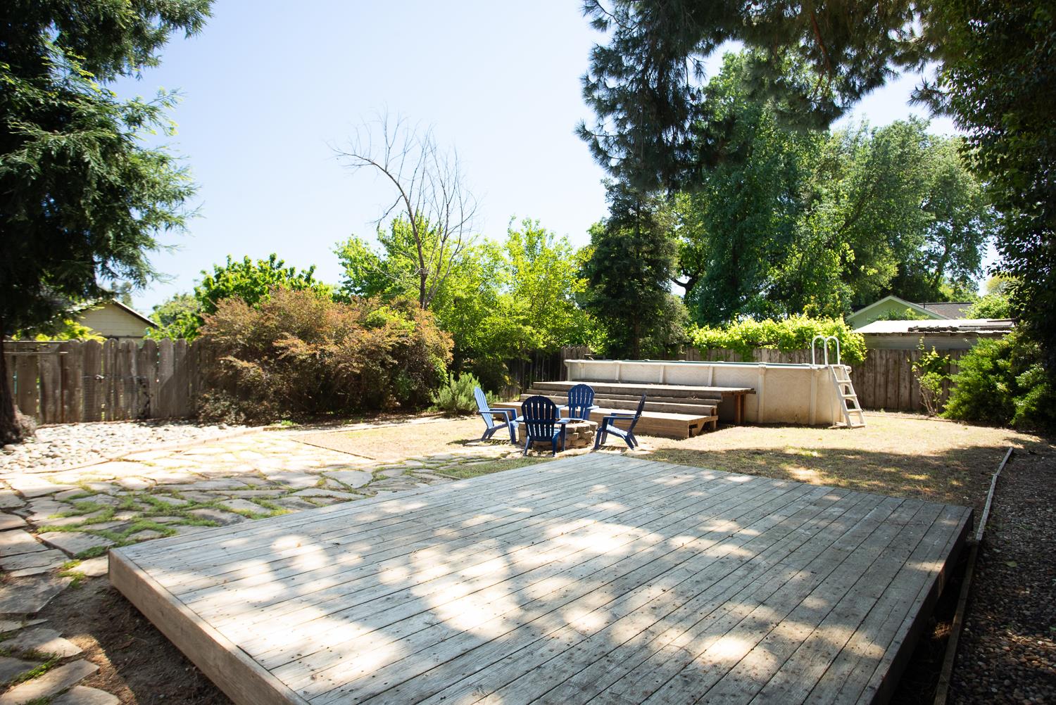 1835 Magnolia Street Gridley, CA 95948 - Photo 28 of 53 a wooden bench sitting in the middle of a yard