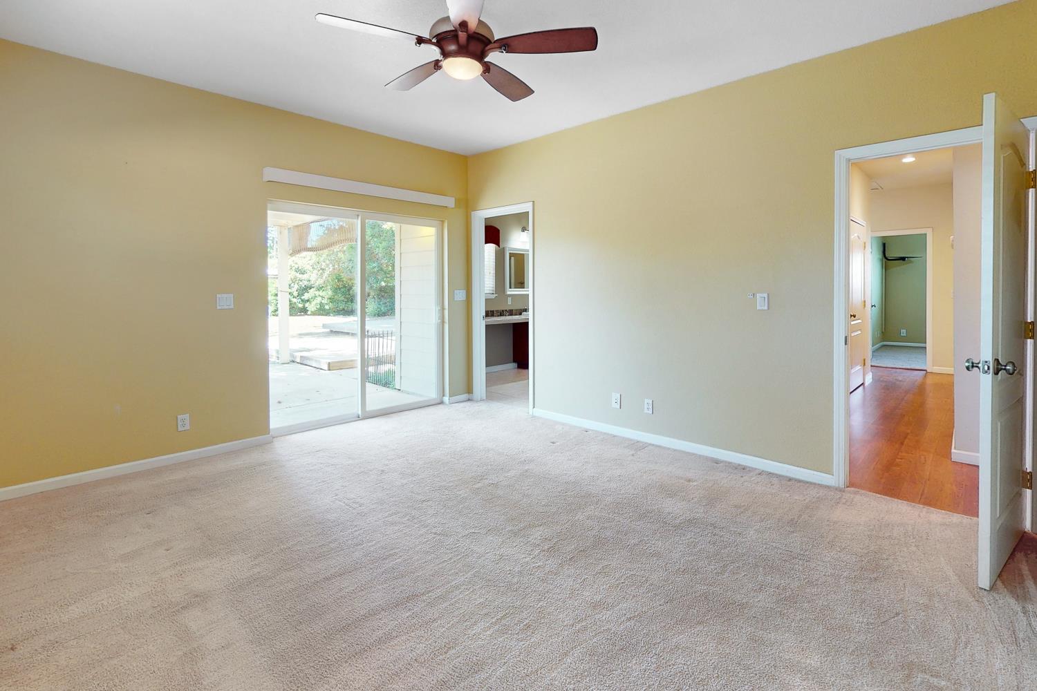 1835 Magnolia Street Gridley, CA 95948 - Photo 34 of 53 a view of a livingroom with a chandelier fan and a fireplace