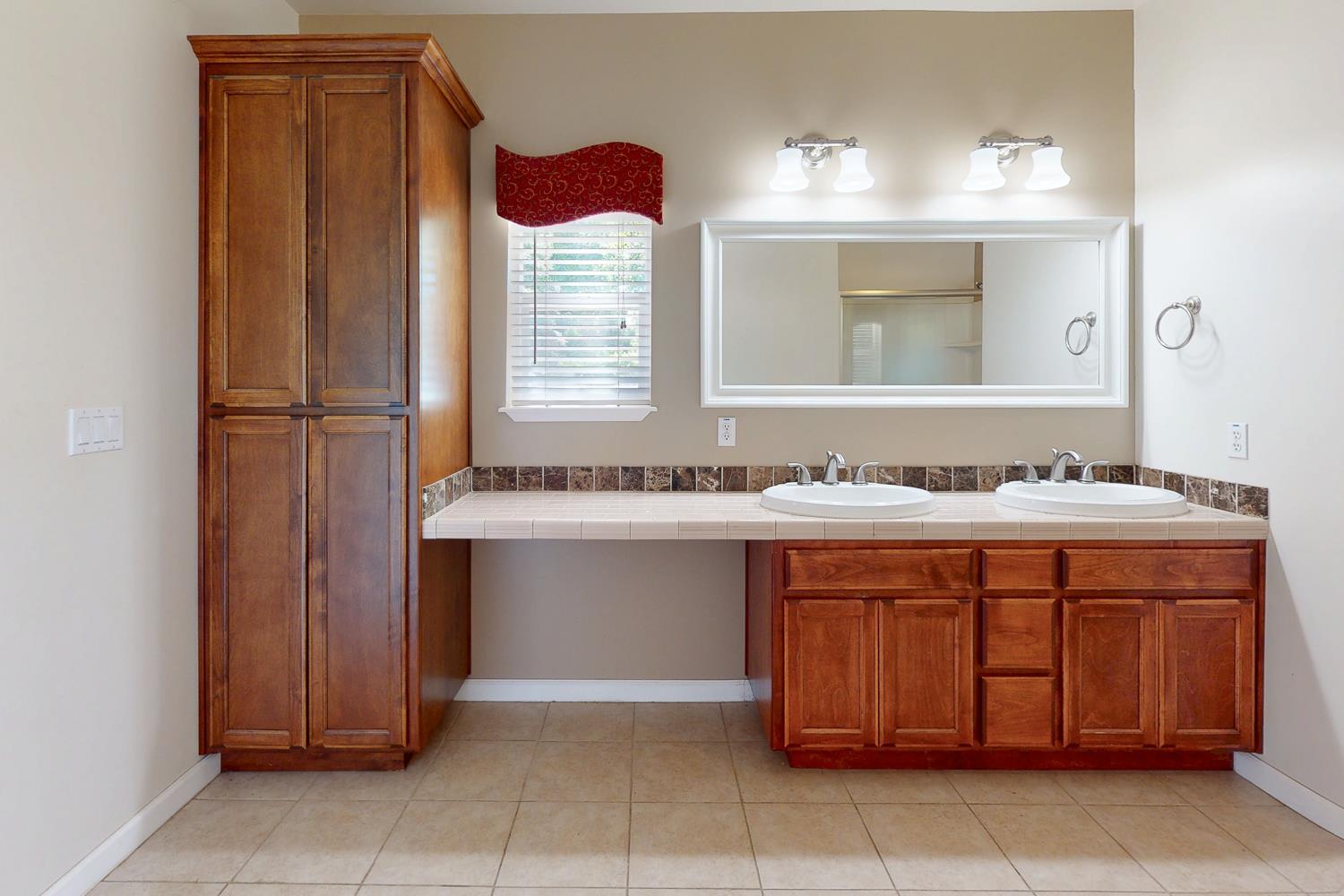 1835 Magnolia Street Gridley, CA 95948 - Photo 36 of 53 a bathroom with a sink and a mirror