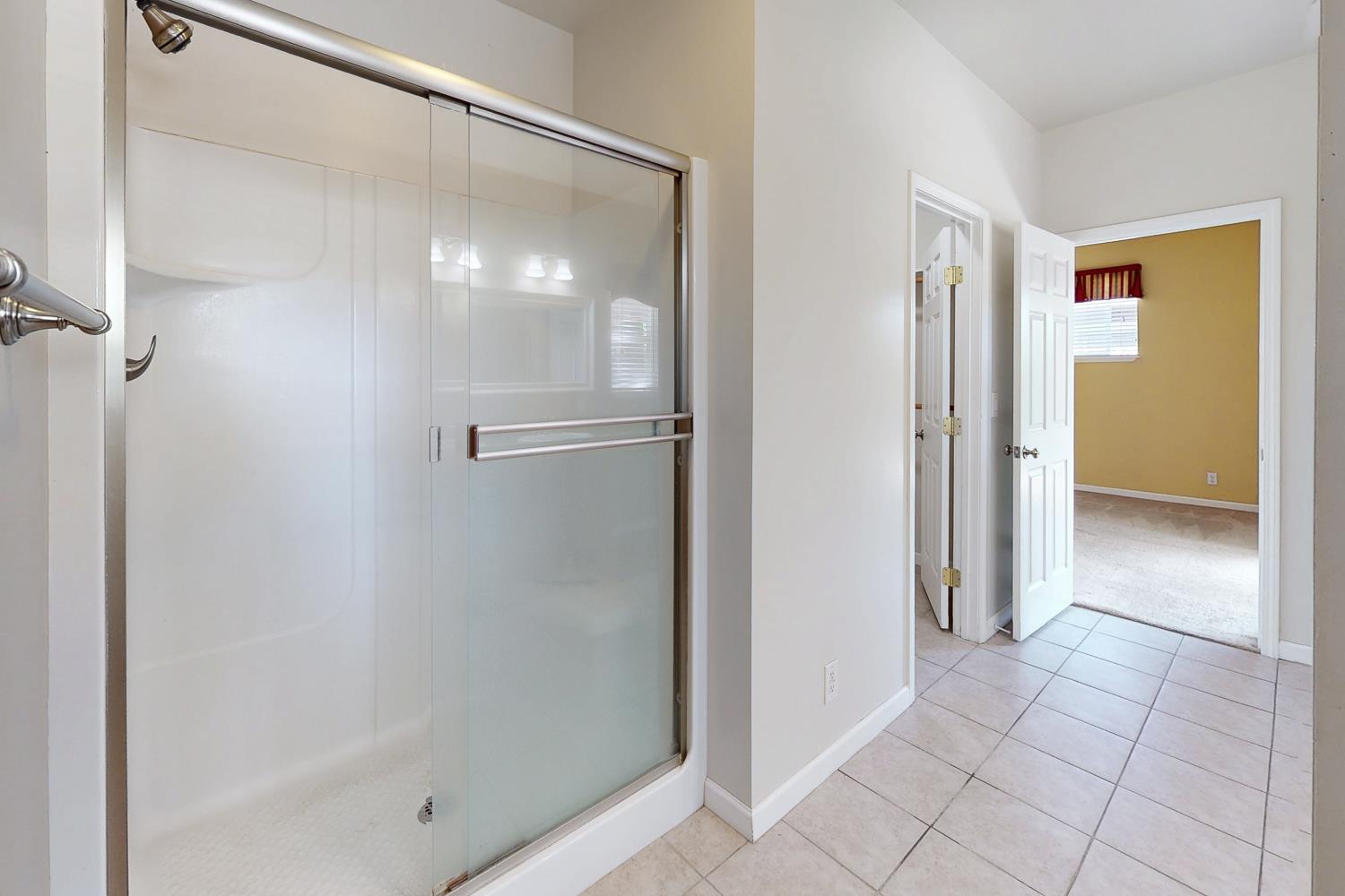 1835 Magnolia Street Gridley, CA 95948 - Photo 39 of 53 a bathroom with a glass shower door