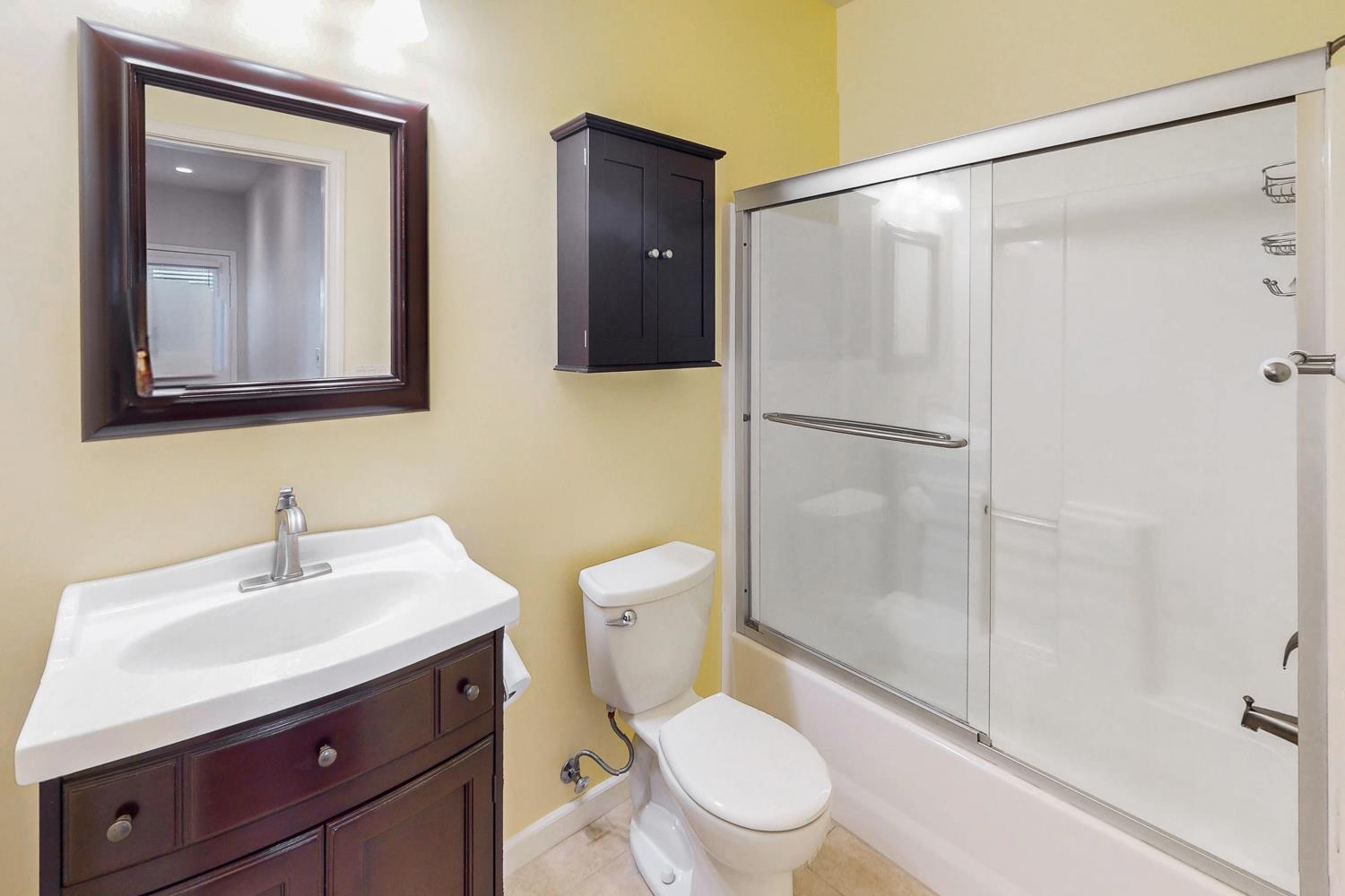 1835 Magnolia Street Gridley, CA 95948 - Photo 41 of 53 a white toilet sitting next to a bathroom sink