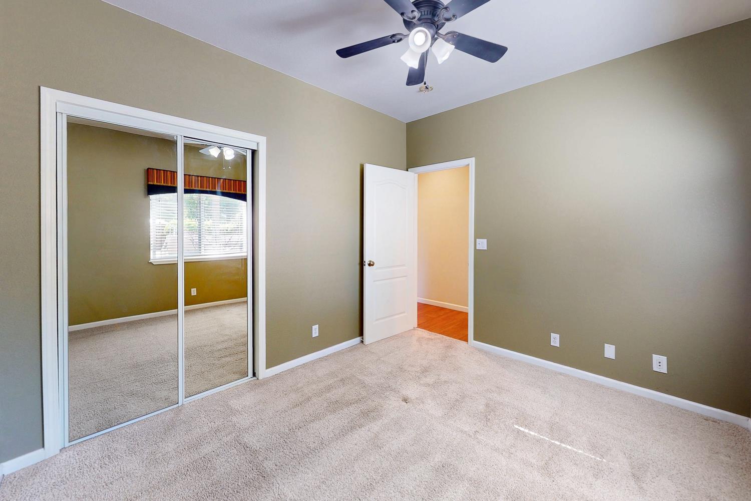 1835 Magnolia Street Gridley, CA 95948 - Photo 47 of 53 an empty room with closet and a chandelier fan