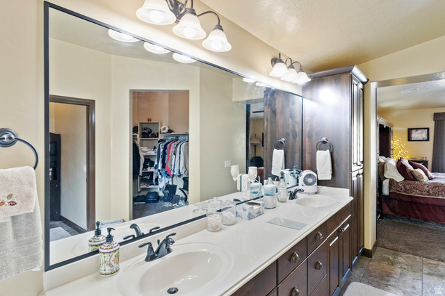 210 Talon Court Ivins, UT 84738 - Photo 31 of 60 Full bath with ensuite bathroom, double vanity, and a spacious closet