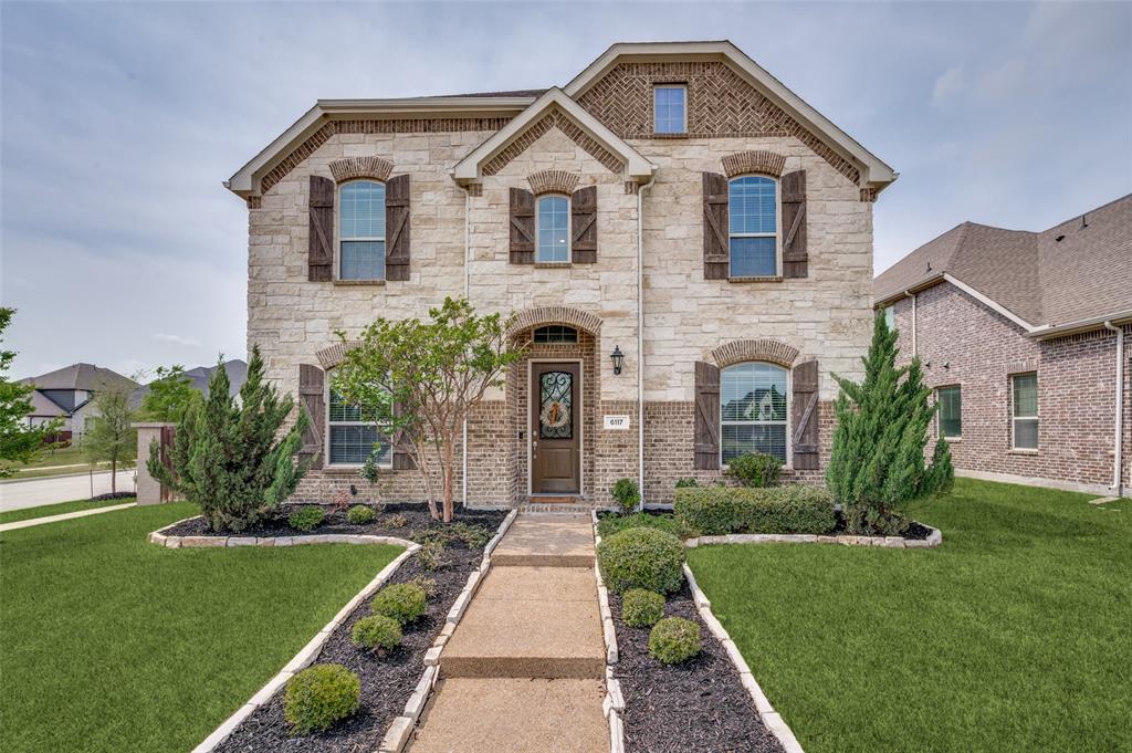 6117 Hall Road Frisco, TX 75034 - Photo 1 of 32 French country inspired facade with a front yard and stone siding