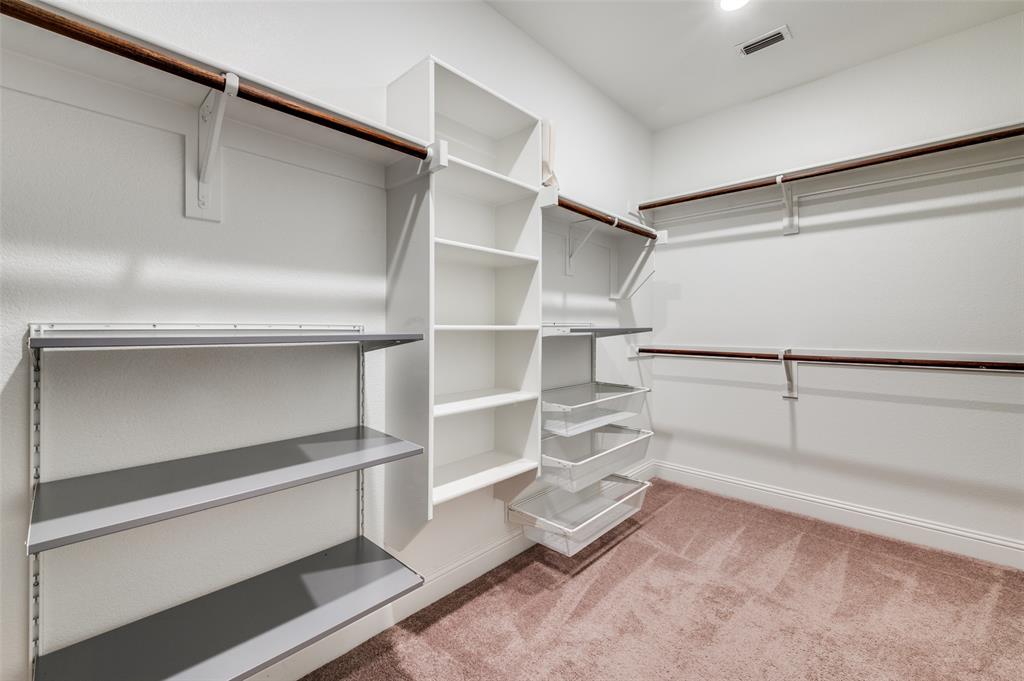 6117 Hall Road Frisco, TX 75034 - Photo 16 of 32 Walk in closet featuring light carpet