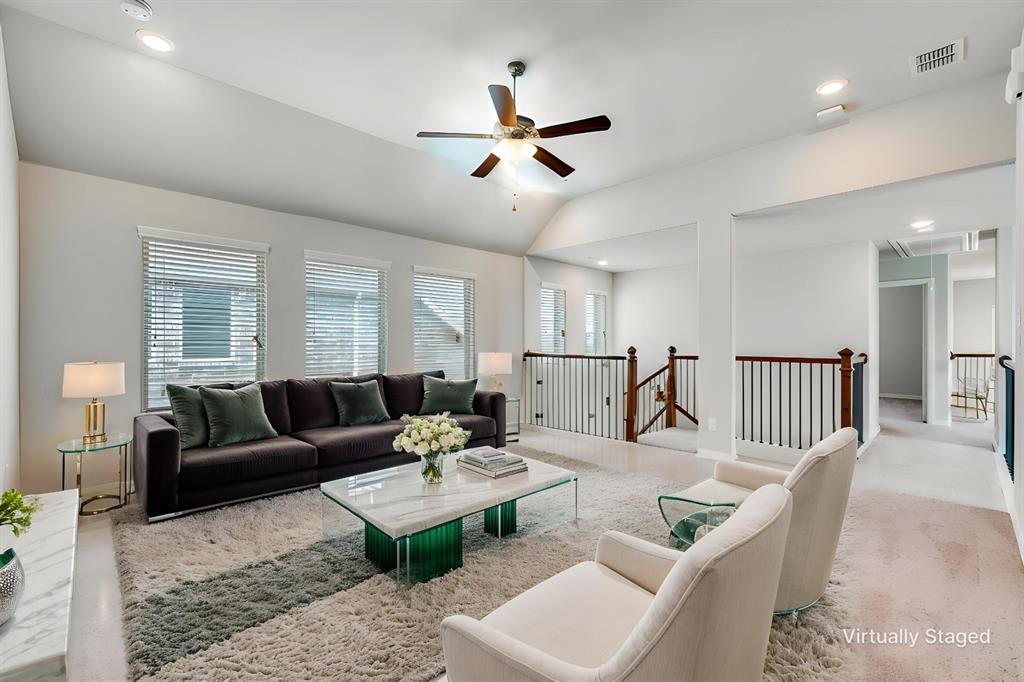 6117 Hall Road Frisco, TX 75034 - Photo 19 of 32 Carpeted living room with ceiling fan, recessed lighting, and lofted ceiling