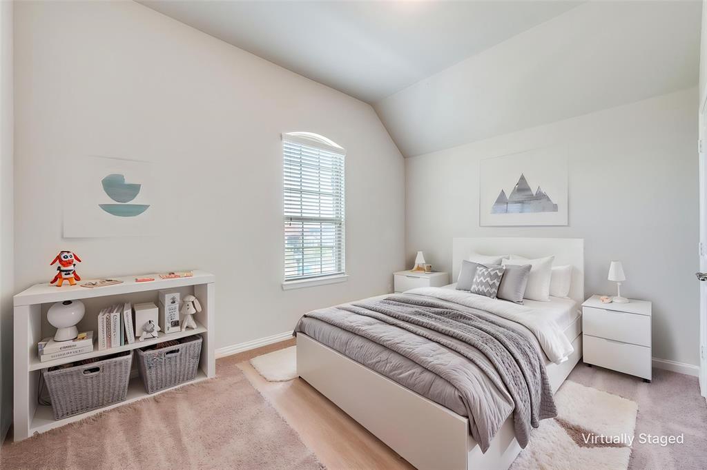 6117 Hall Road Frisco, TX 75034 - Photo 23 of 32 Bedroom with baseboards and lofted ceiling
