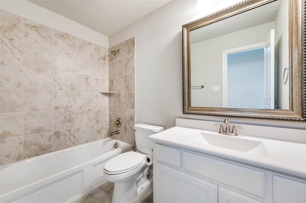 6117 Hall Road Frisco, TX 75034 - Photo 24 of 32 Full bathroom featuring vanity and tub / shower combination