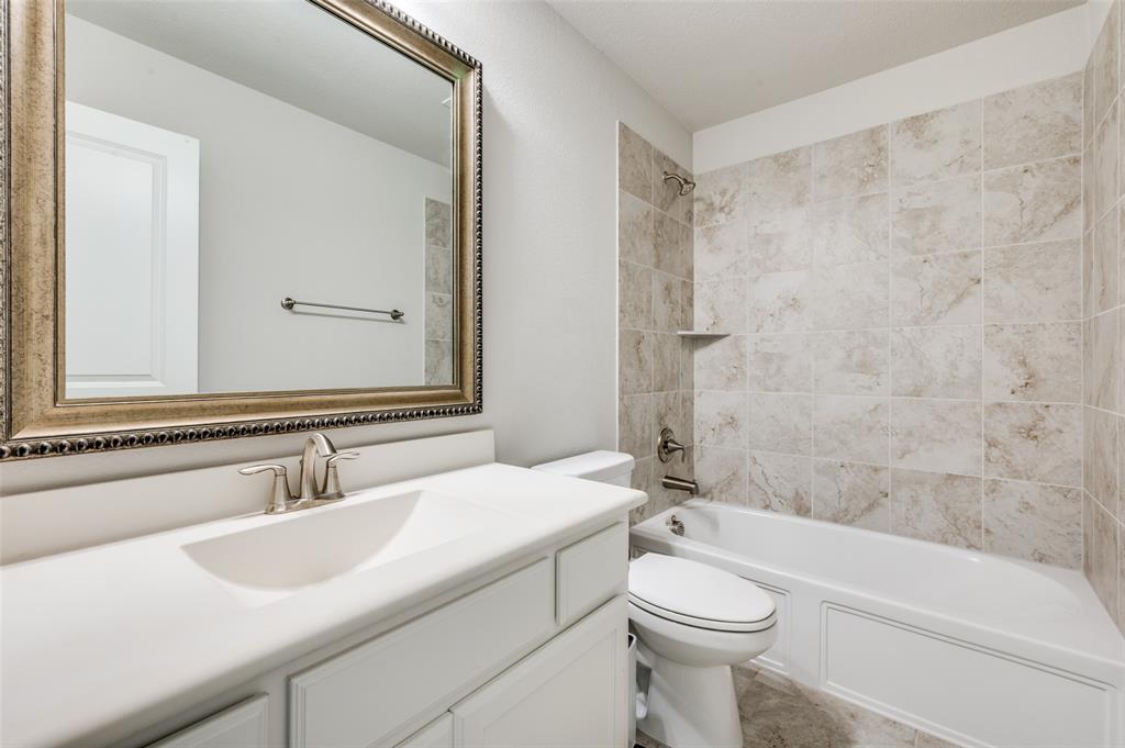 6117 Hall Road Frisco, TX 75034 - Photo 25 of 32 Bathroom with vanity and bathing tub / shower combination