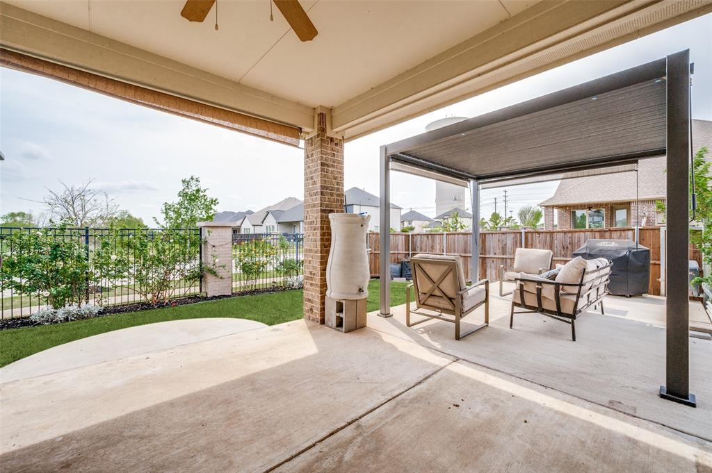 6117 Hall Road Frisco, TX 75034 - Photo 26 of 32 Fenced backyard with a grill, a patio, and a ceiling fan