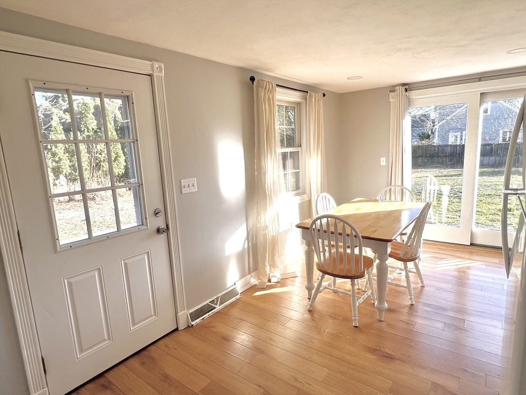 495 Sandwich Road Falmouth, MA 02536 - Photo 3 of 9 a view of a livingroom with furniture and wooden floor