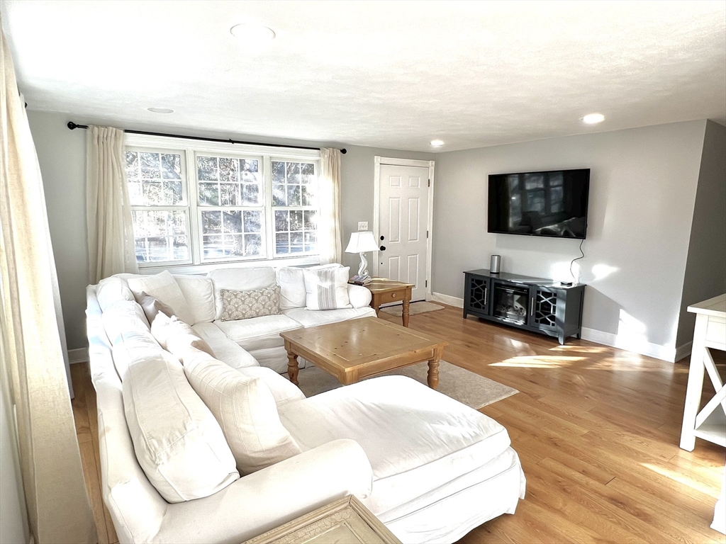 495 Sandwich Road Falmouth, MA 02536 - Photo 4 of 9 a living room with furniture and a flat screen tv
