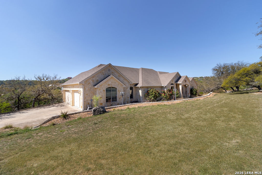198 Echo Falls Road Comfort, TX 78013 - Photo 2 of 25 a house view with a outdoor space
