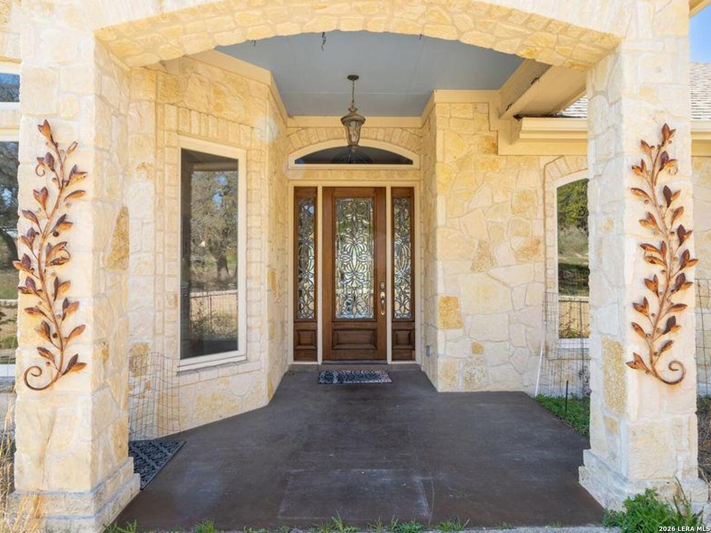 198 Echo Falls Road Comfort, TX 78013 - Photo 3 of 25 a front view of a house with a porch