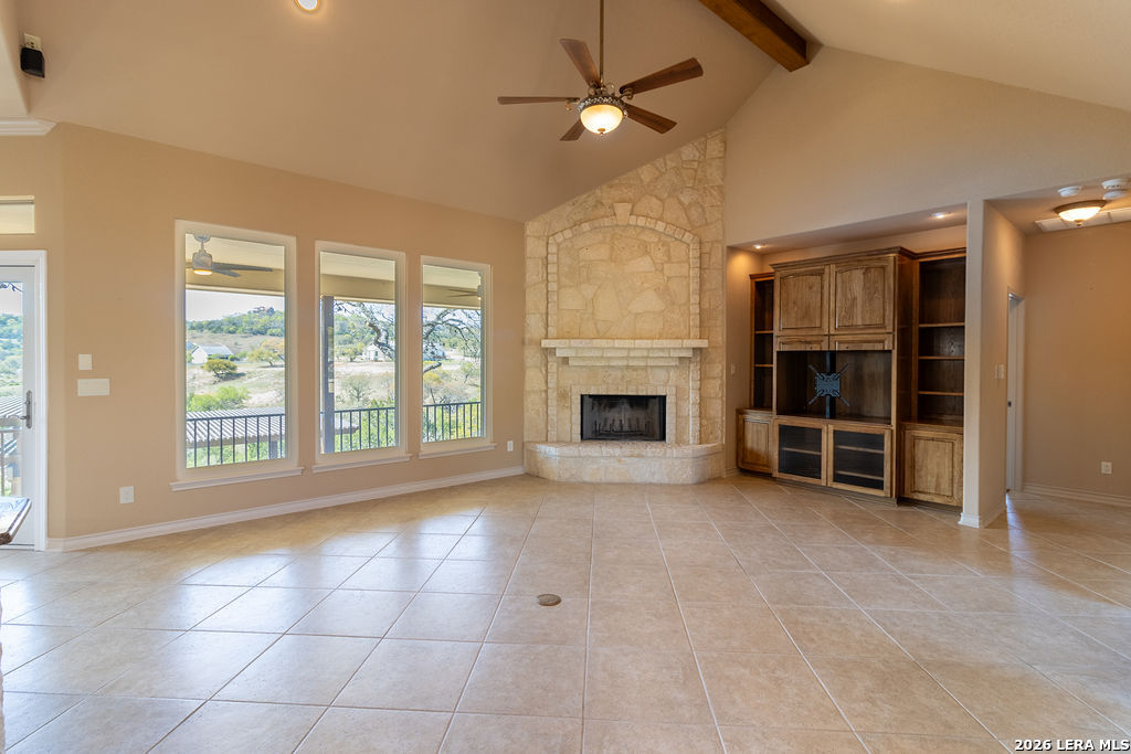 198 Echo Falls Road Comfort, TX 78013 - Photo 7 of 25 a view of an empty room with a fireplace and a window