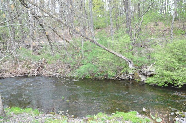 259 Wieboldt Road Cresco, PA 18326 - Photo 16 of 16 a view of a lake in middle of forest