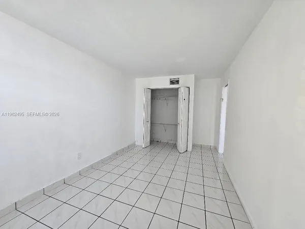 a view of an empty room and window