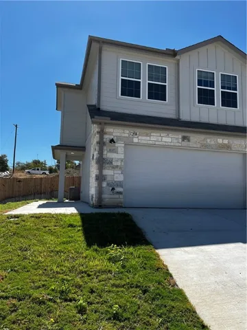 a view of a backyard of the house