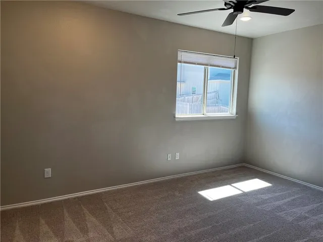 a bathroom with a granite countertop sink a toilet and bathtub
