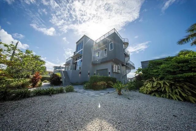 a view of a street with a building in the background