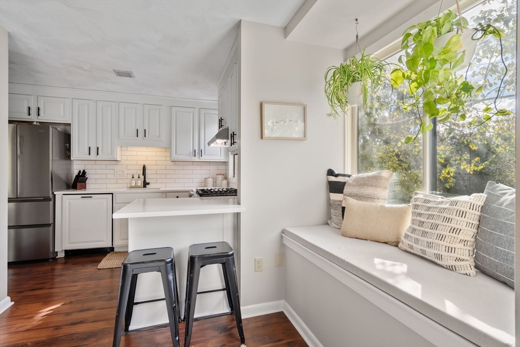 22 Concord Greene, Unit 2 Concord, MA 01742 - Photo 14 of 36 a living room with stainless steel appliances granite countertop furniture and a refrigerator