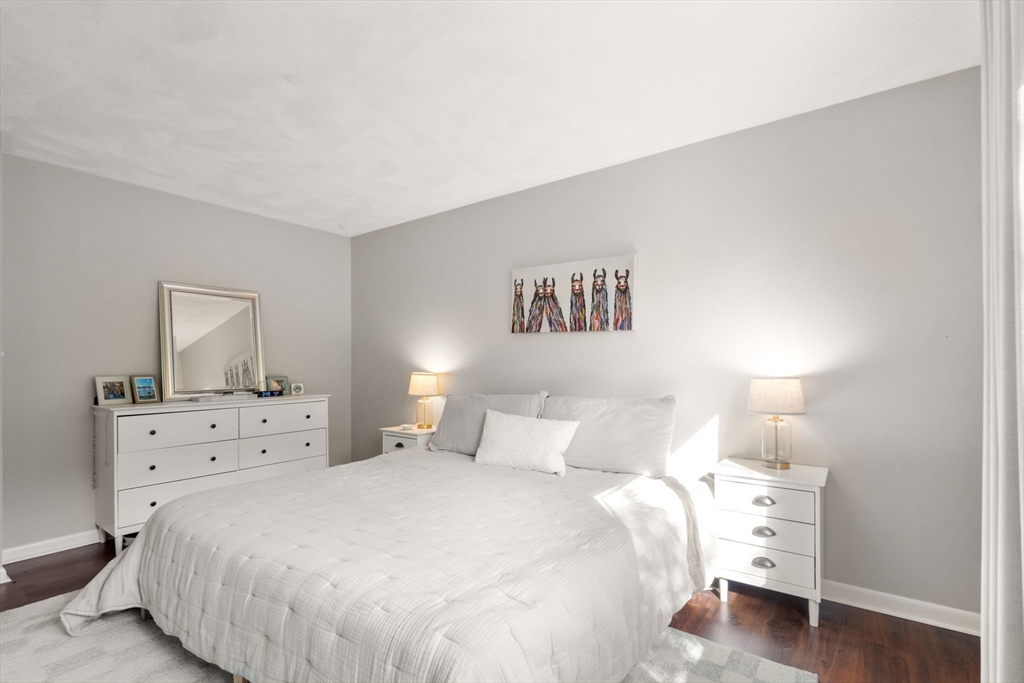 22 Concord Greene, Unit 2 Concord, MA 01742 - Photo 20 of 36 a bedroom with a bed and a night stand