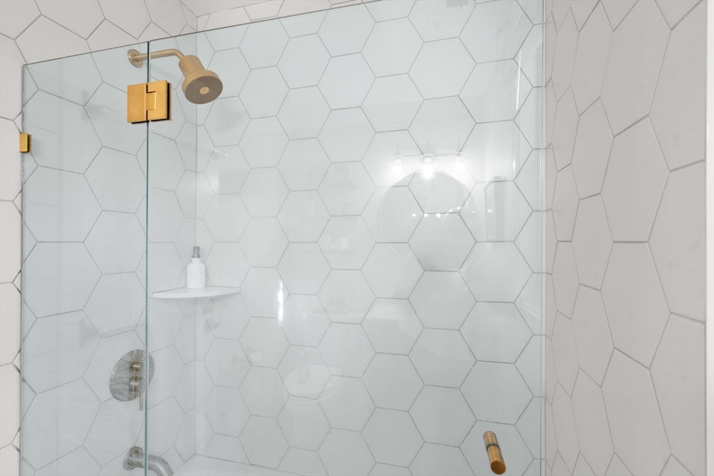 22 Concord Greene, Unit 2 Concord, MA 01742 - Photo 23 of 36 a bathroom with a shower