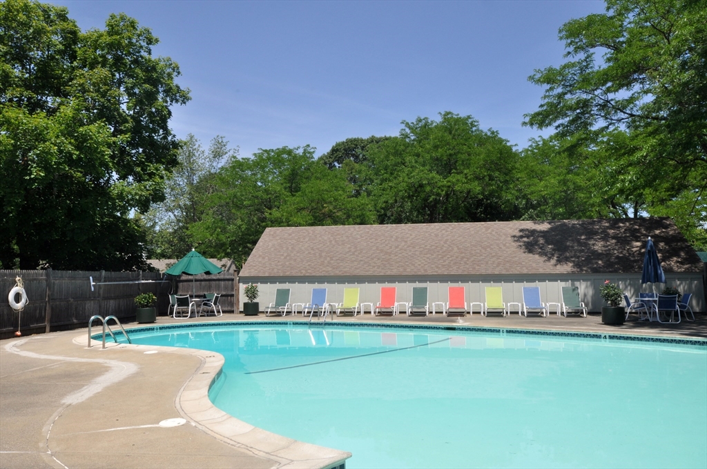 22 Concord Greene, Unit 2 Concord, MA 01742 - Photo 36 of 36 a view of a house with a yard deck and a slide