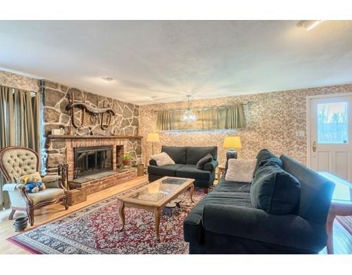 74 Hobbs Road Princeton, MA 01541 - Photo 17 of 27 a living room with furniture a fireplace and a table