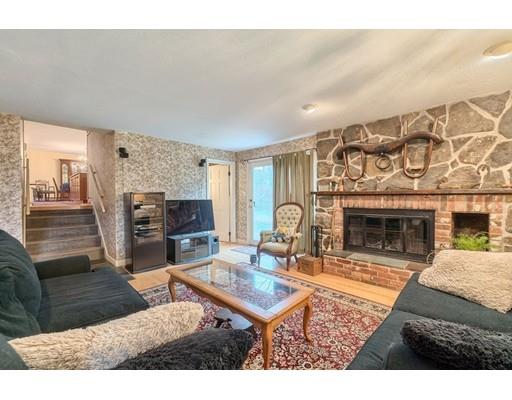 74 Hobbs Road Princeton, MA 01541 - Photo 18 of 27 a living room with furniture a fireplace and a flat screen tv