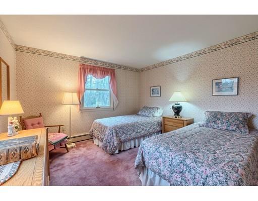 74 Hobbs Road Princeton, MA 01541 - Photo 21 of 27 a bedroom with two beds and a lamp on the dresser