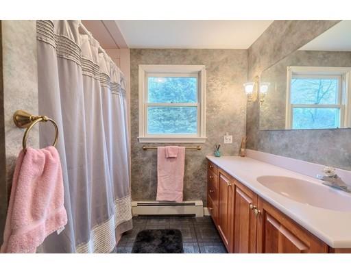74 Hobbs Road Princeton, MA 01541 - Photo 26 of 27 a bathroom with a sink a mirror and a bathtub