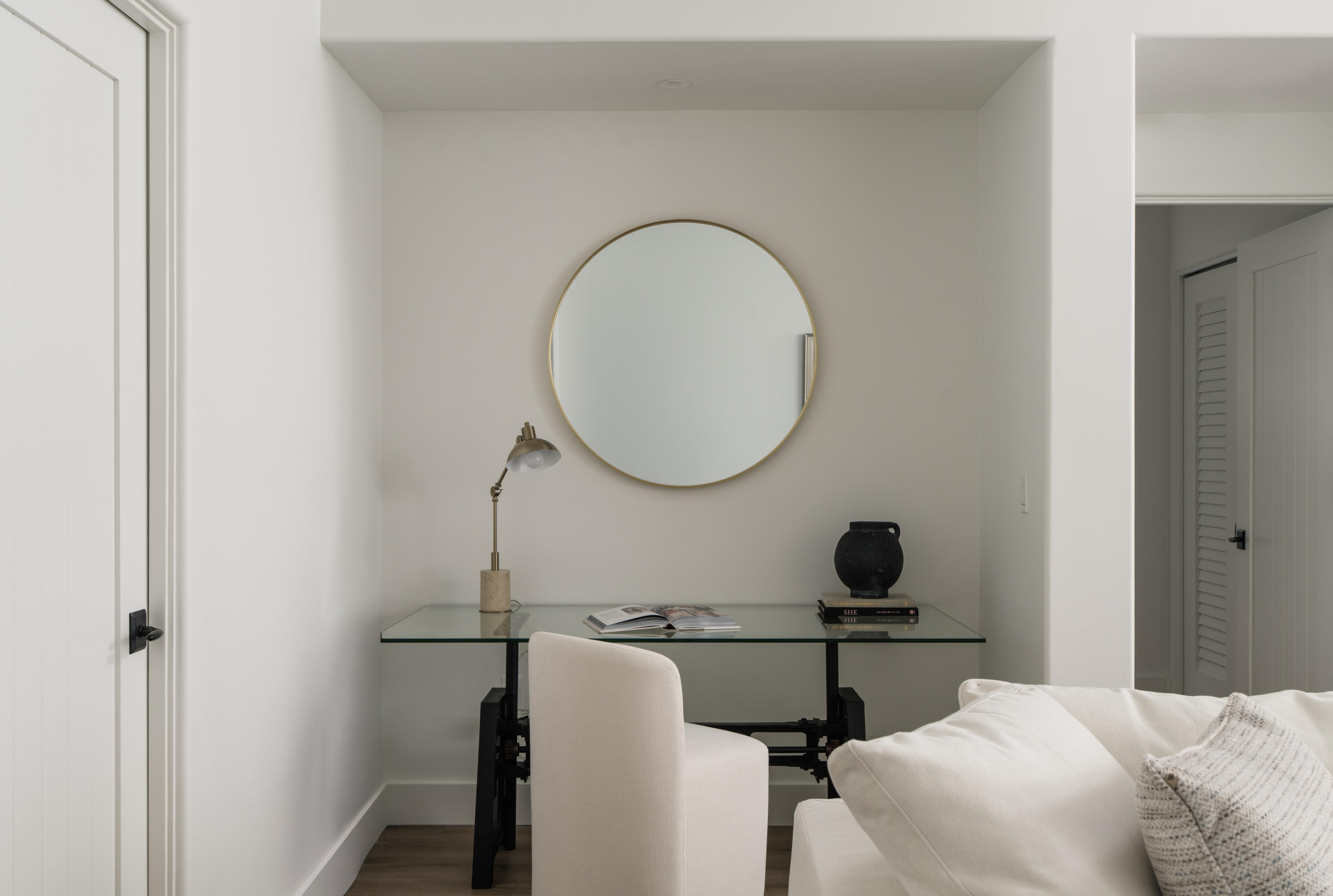 18 West Victoria Street, Unit 206 Santa Barbara, CA 93101 - Photo 11 of 18 a living room with a mirror and a wooden floor