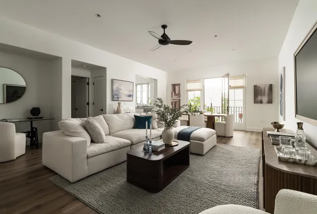 a living room with furniture or couch and a wooden floor