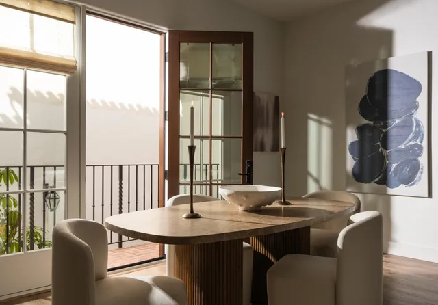 a view of a dining room with furniture window and wooden floor